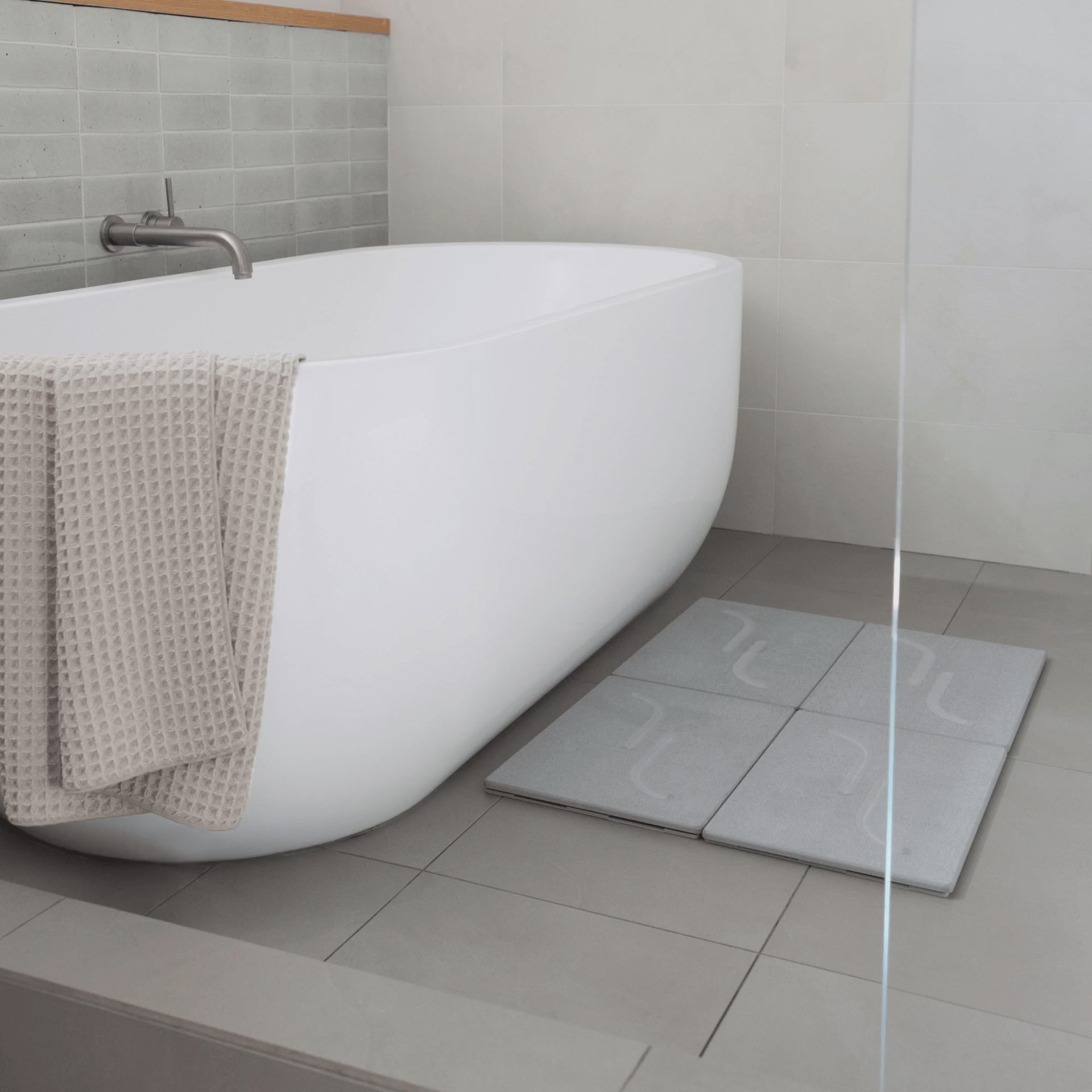 Large arch bath stone mat in Ash with customizable layout. 