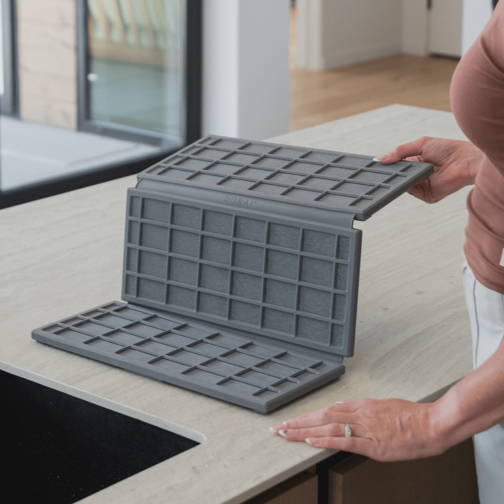 Ridge Dish Pad in Slate folds up when not in use.