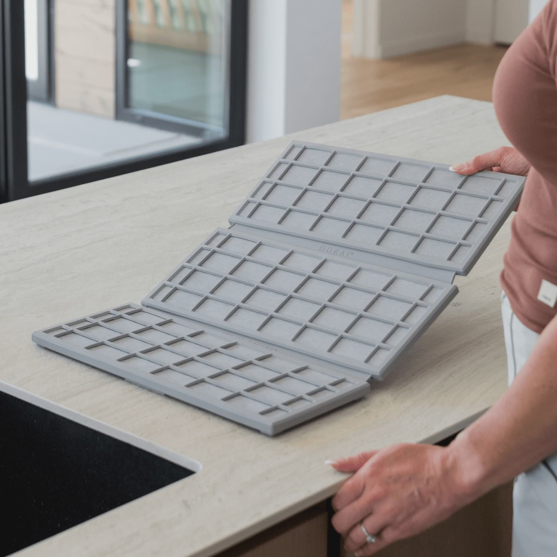 Ridge Dish Pad in Ash folds up when not in use.