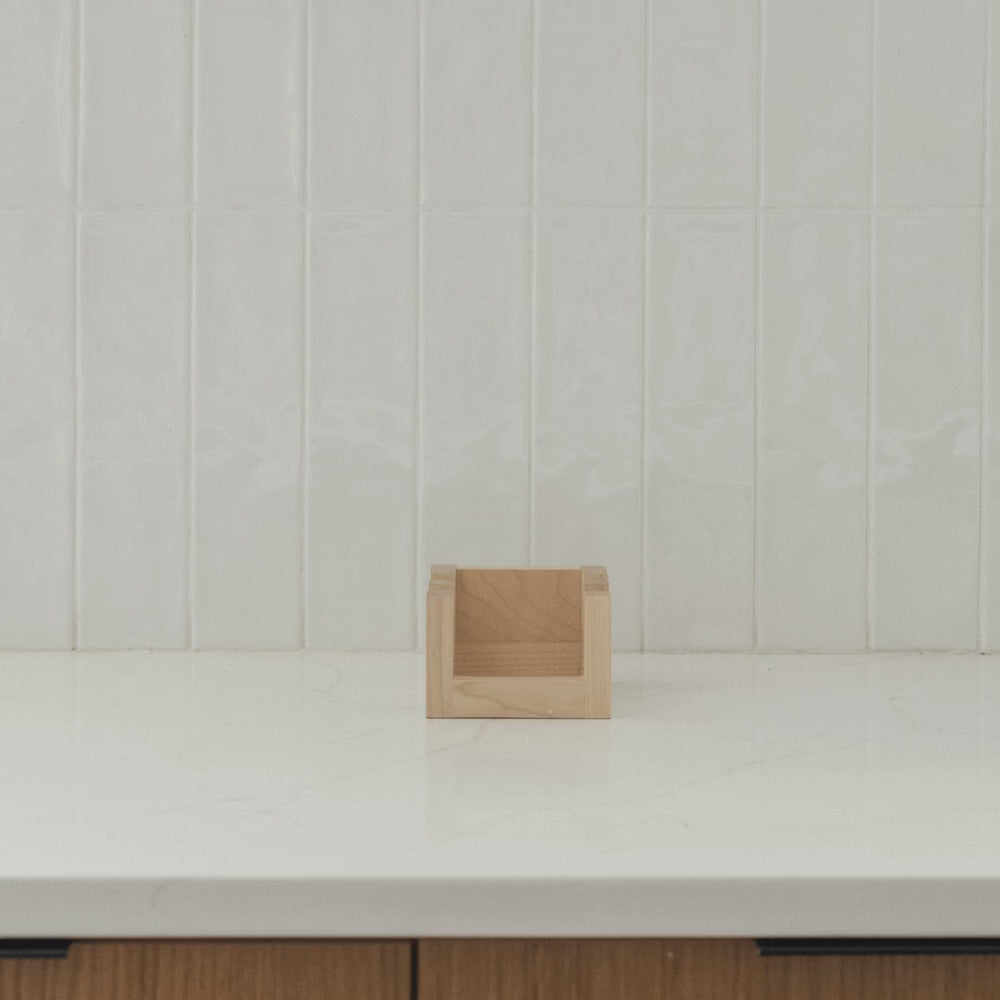 Maple Cutting Board Holder can hold cutting boards, dish pad, reusable bags, pot lids, cookie sheets, and more. 
