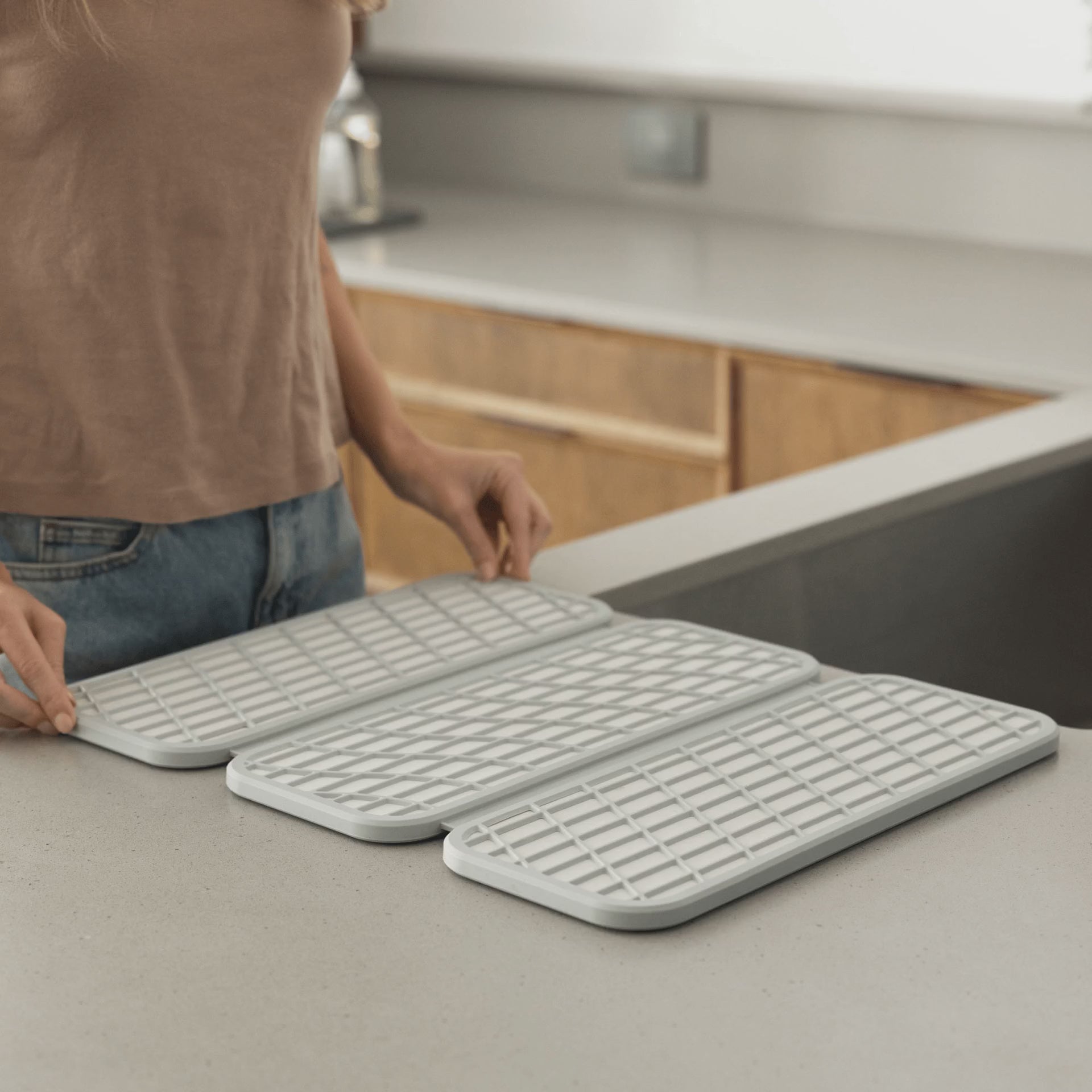 Drift Sandstone Dish Pad folds when not in use.
