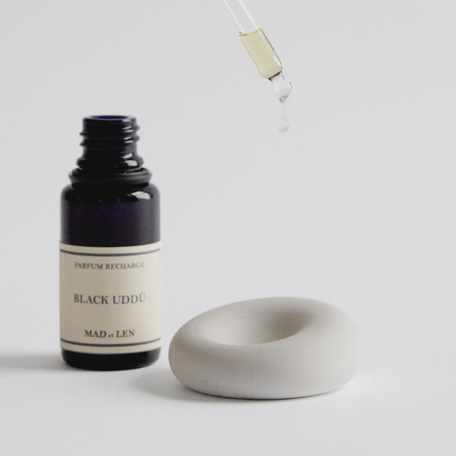 video of essential oil being dripped on sent stone that diffuses aroma