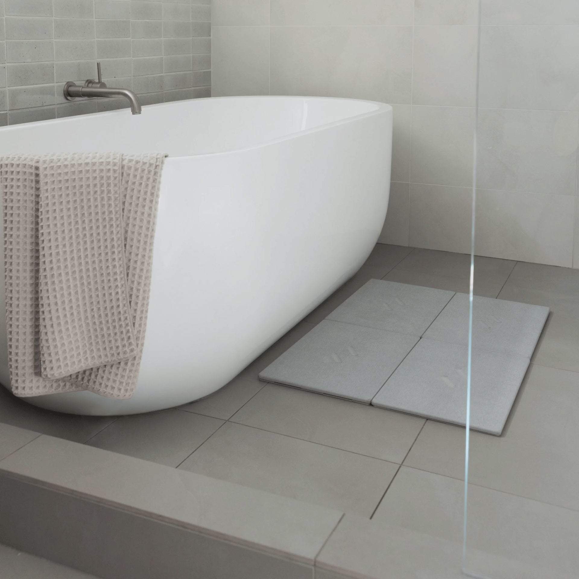 Large Alta bath stone in Ash with customizable layout. 