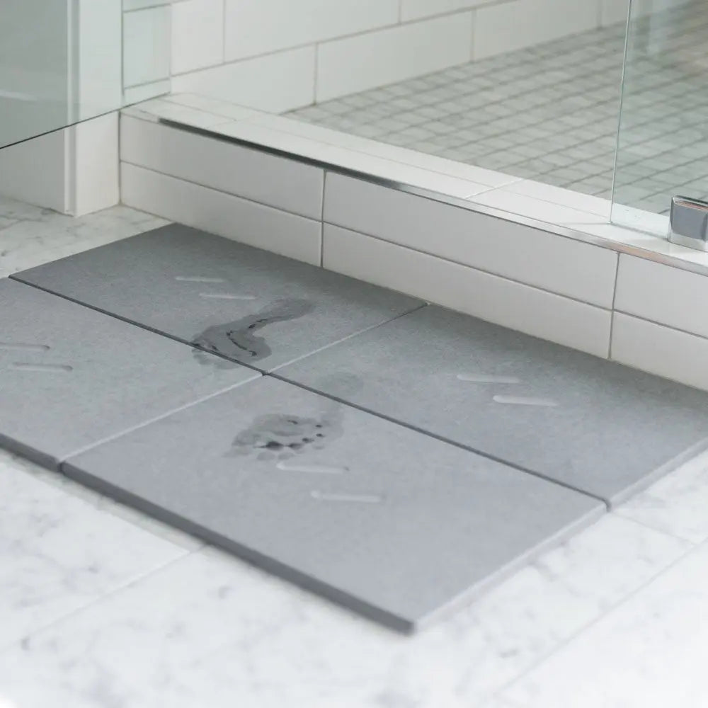 wet footprints drying on slate large bath stone mat