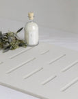 Bath Stone Mat Rain Sandstone with leaves and bottle