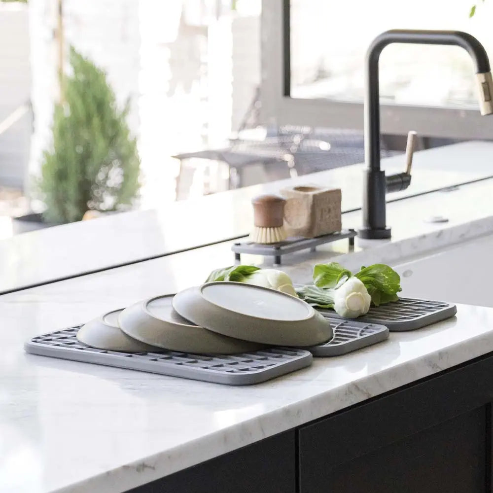 slate dish pad with plates and vegetables on it