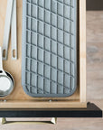 slate dish pad stowed away in a kitchen drawer