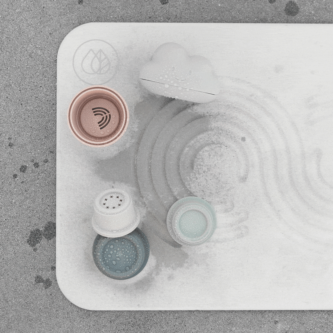 GIF of Dorai Bath Stone drying with bath toys