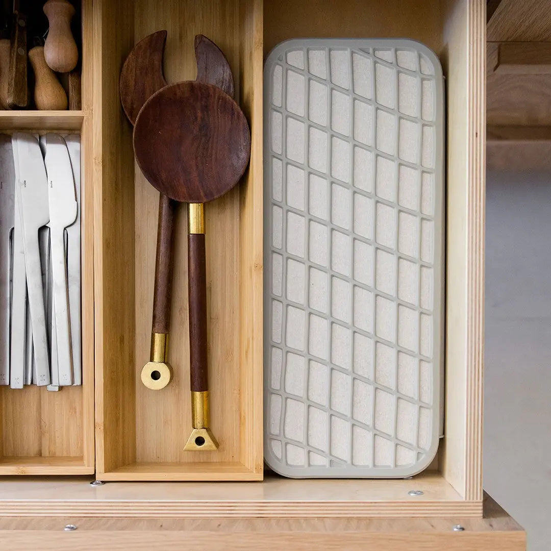 Compactable Dorai dish pad stored in drawer.