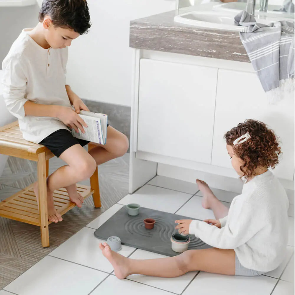 Slate Bath Stone™ with children playing in bathroom