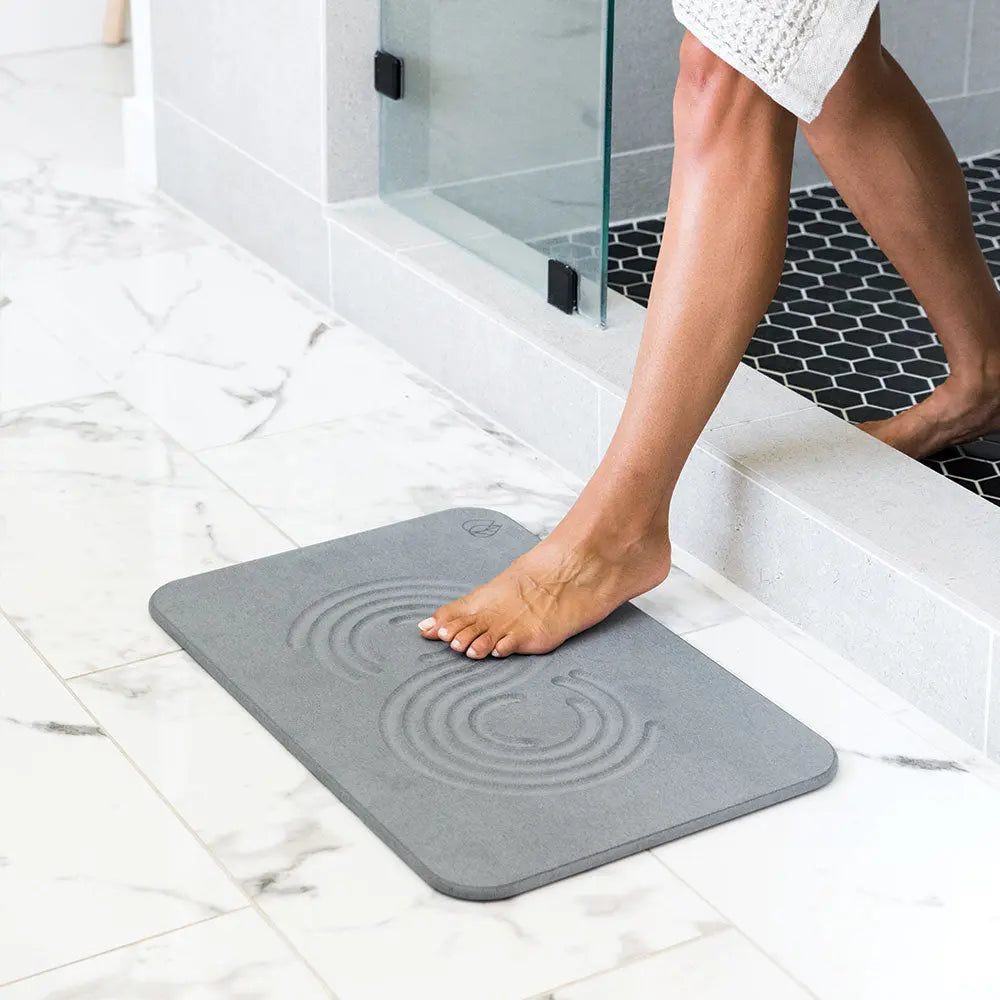 Woman stepping onto Slate Bath Stone™